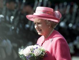 HM The Queen moves out to inspect the Honour Guard